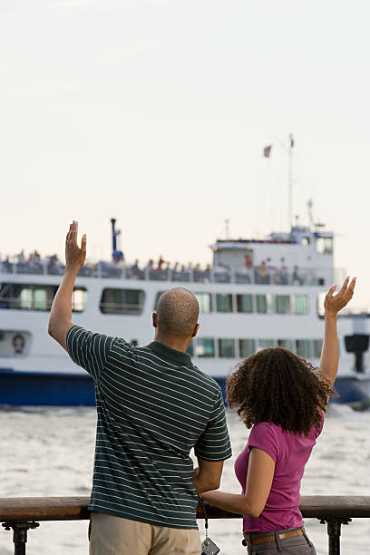 Waving at people on boats